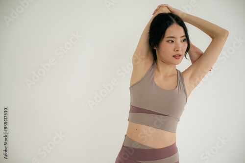 Asian woman yoga routine at Yoga studio