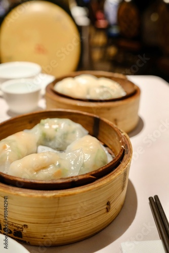 Bamboo steamers of assorted seafood and vegetable dumplings (scallop and chives, prawn and spinach) at The Eight, a yumcha restaurant at Sydney Chinatown photo