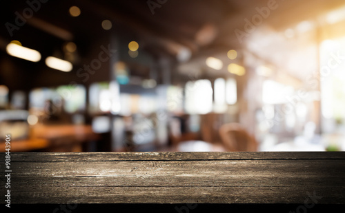 A wooden tabletop with a blurred background of a cafe interior.