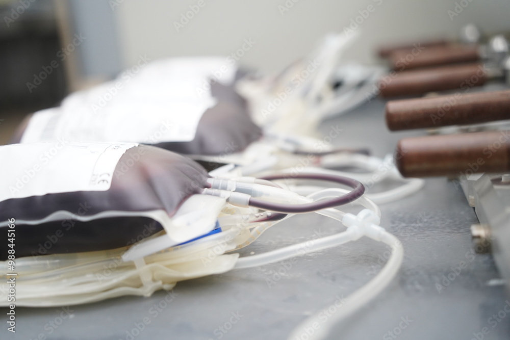 A container with donated blood on the table. The blood center. A container with donated blood on the table. The blood center.