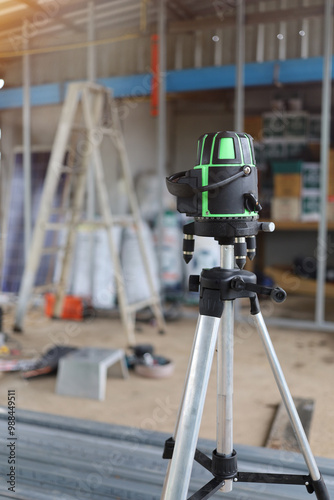 Fotografi Laser level on a tripod for setting the exact level at construction site