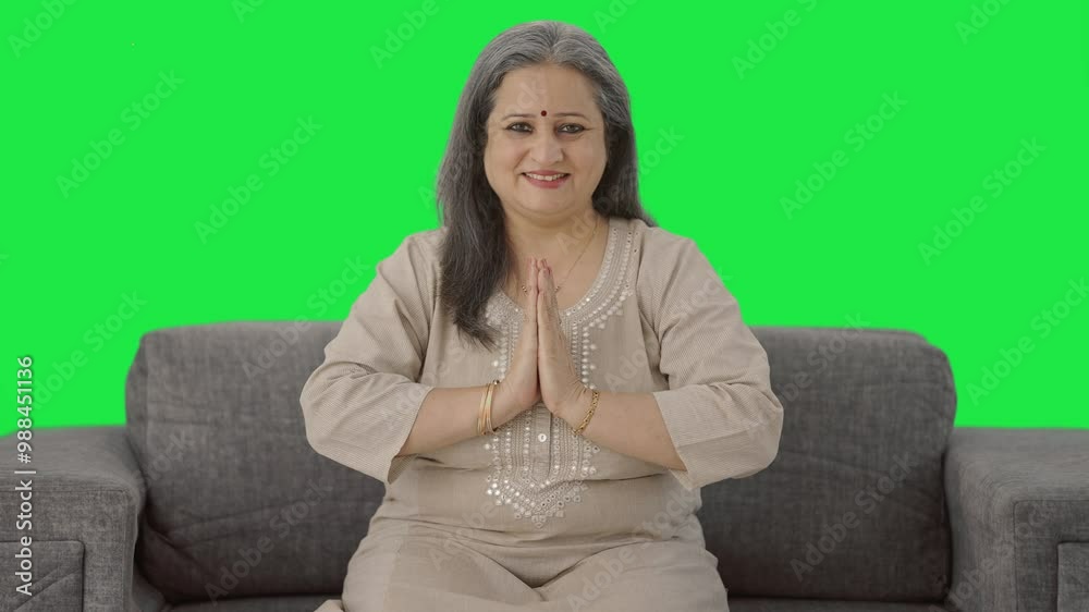 Happy Indian old woman doing Namaste and greeting Green screen Happy Indian old woman doing Namaste and greeting Green screen