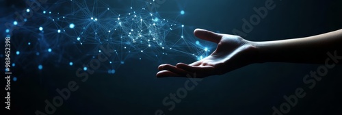 Hand extended towards a glowing digital network, symbolizing technology, AI, and connectivity. photo