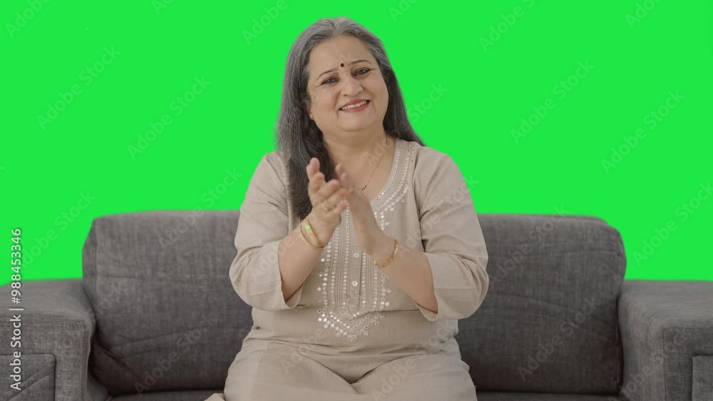 Happy Indian old woman clapping and appreciating Green screen Happy Indian old woman clapping and appreciating Green screen