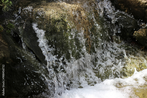 water fall flowing between rocks close up photo