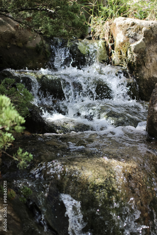 water fall flowing between rocks close up water fall flowing between rocks close up