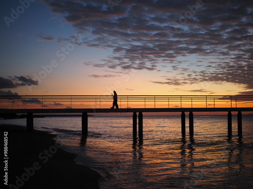 sunset, pier, sea, beach, ocean, sky, sun, beautiful, calm, horizon, red, blue, landscape, coast, bridge, water, purple, clouds, peopleshadow, shadow, impressive, scenary.