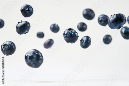 A cluster of blueberries suspended in mid-air, perfect for illustrations or designs related to food, nature, or whimsy