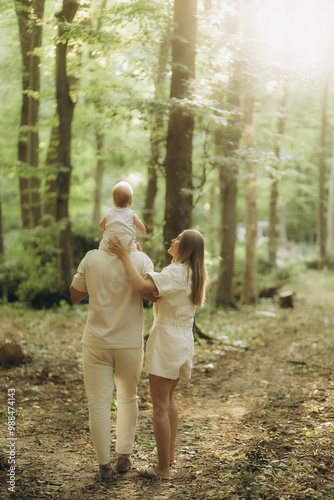 a young family on a walk in the woods