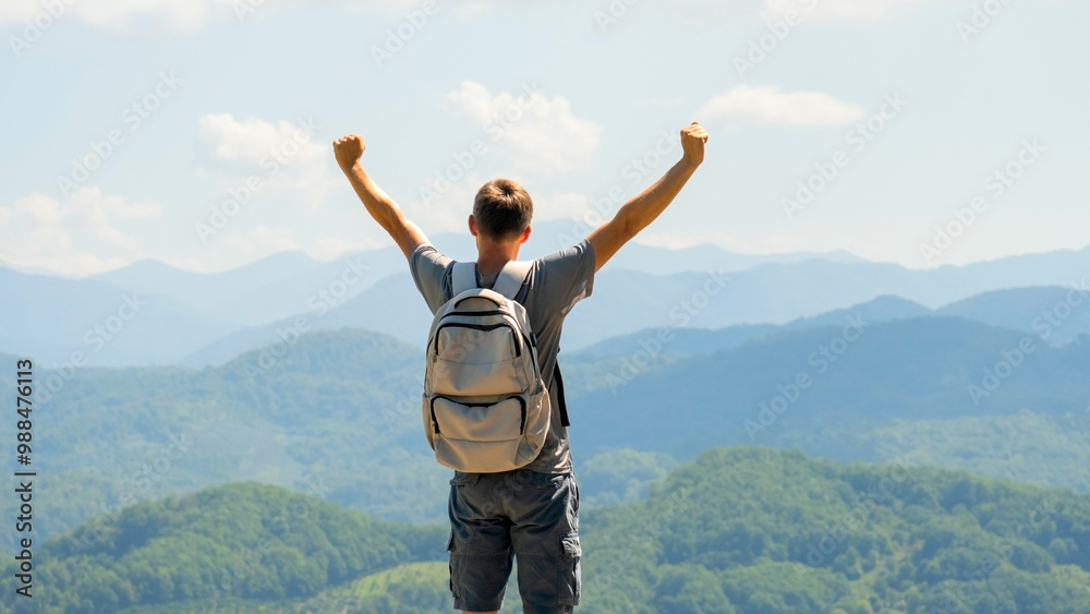 Male hiker celebrating climbing to the top Male hiker celebrating climbing to the top