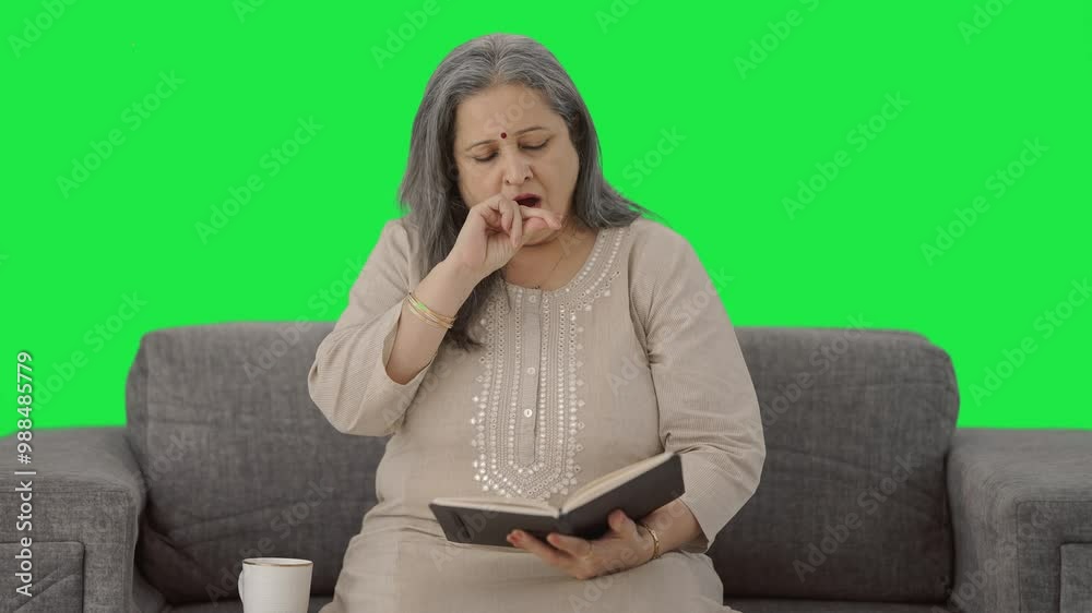 Sleepy Indian old woman reading a book in morning Green screen Sleepy Indian old woman reading a book in morning Green screen