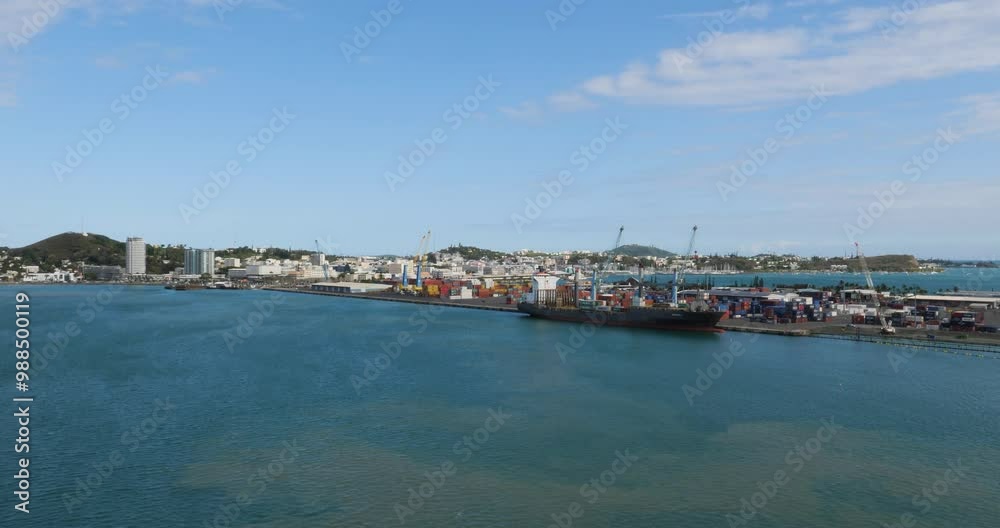 Noumea, port container terminal and the city in the background. New Caledonia. Noumea, port container terminal and the city in the background. New Caledonia.