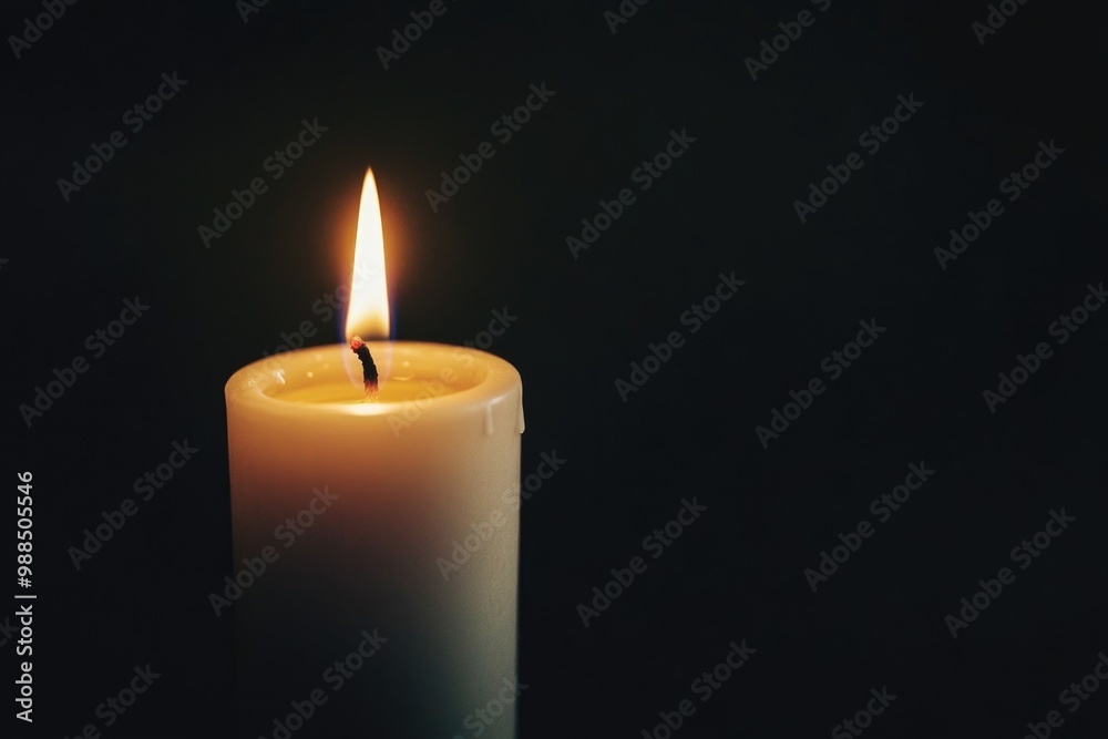 One bright pure white candle in a holder, glowing softly against the dark background. One bright pure white candle in a holder, glowing softly against the dark background.