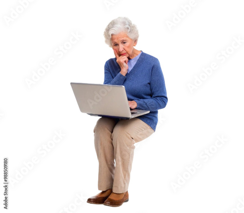 Senior woman sitting and using laptop with puzzled expression