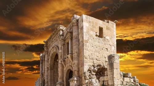 Arch of Hadrian in Gerasa (Jerash)-- was built to honor the visit of emperor Hadrian to Jerash in 129-130 AD, Jordan. Against the sunset. 4K, time lapse    photo