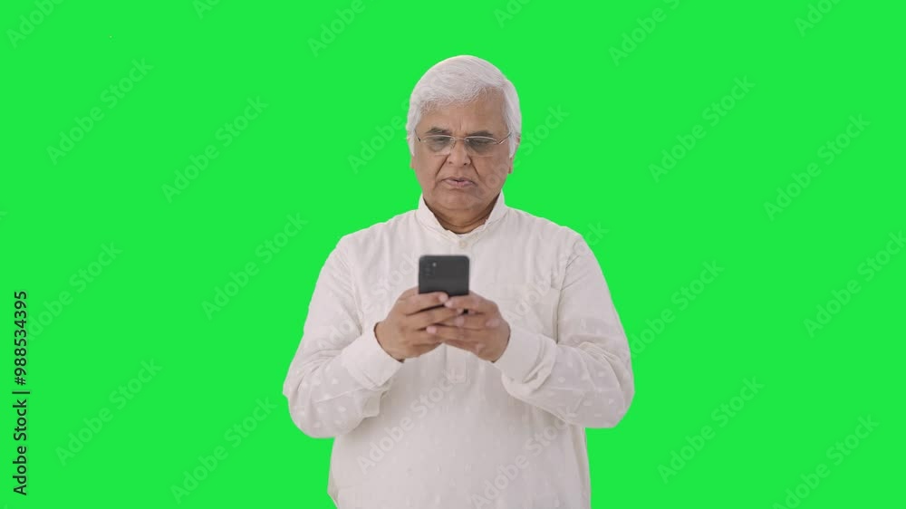 Indian old man chatting on phone Green screen Indian old man chatting on phone Green screen