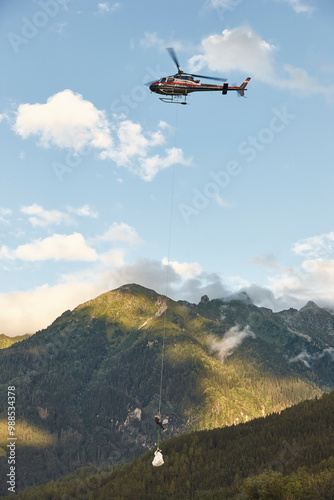 Helicopter rescue training simulation in a mountain range wood. Police