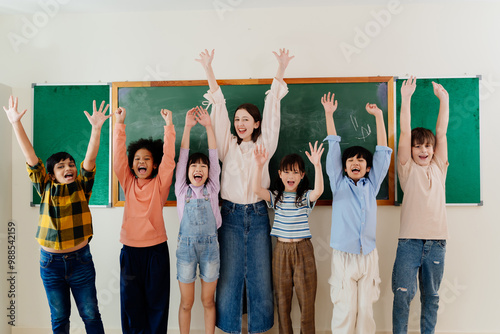 Diverse Young Pupils and Enthusiastic Educator Express Excitement during School Day, Fostering Inclusive Learning Environment