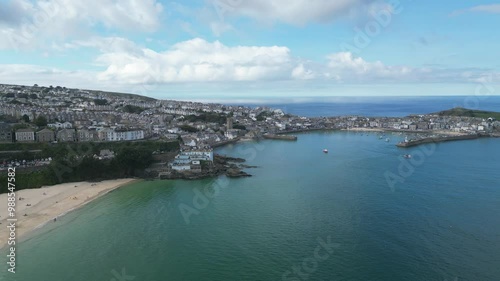 St Ives, Cornwall, England: DRONE VIEWS: The drone circles out from Porthminster beach showing St Ives harbour. St Ives is a renowned UK holiday destination and a magnet for the artist community. photo