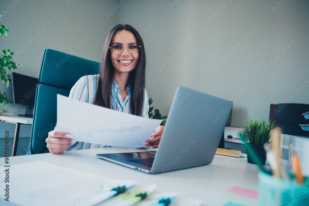 Photo of professional lovely lady working netbook graph papers wear striped formalwear coworking successful businesswoman nice light office Photo of professional lovely lady working netbook graph papers wear striped formalwear coworking successful businesswoman nice light office