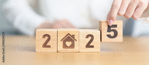 Happy New Year 2025 with Home and Heart block. Property investment, House Mortgage, Real Estate tax, homeless, donation, Financial and happy family concepts