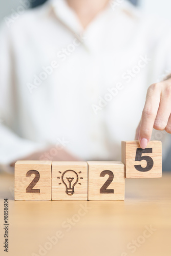 2025 block with lightbulb. Business Idea, Creative, Thinking, brainstorm, Goal, Resolution, strategy, plan, Action, change and New Year start concepts