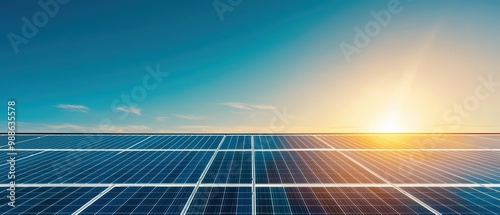 Solar panels with a clear sky and sunrise background.