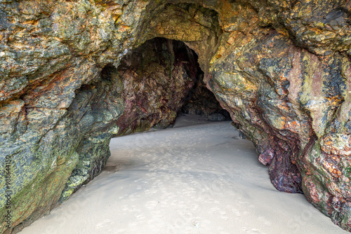 Cave on the beach in Perranporth, Cornwall photo