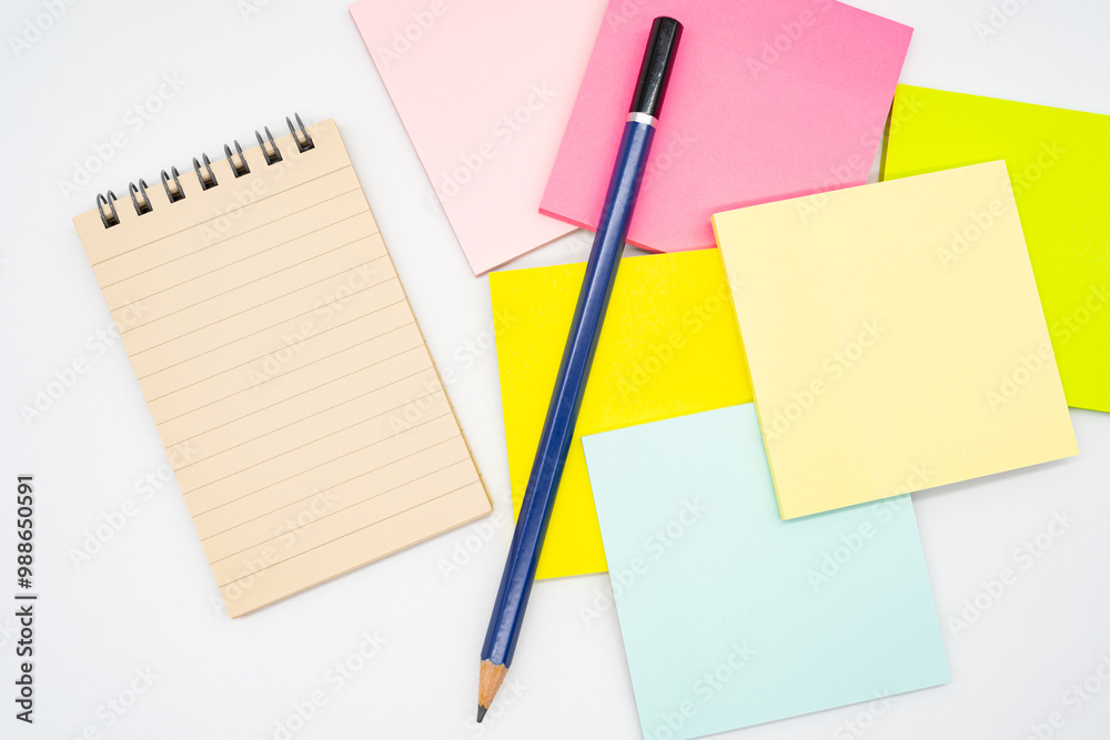 Blank paper note on blank colorful sticky note and pencil isolated on white background. Copy space. Blank paper note on blank colorful sticky note and pencil isolated on white background. Copy space.