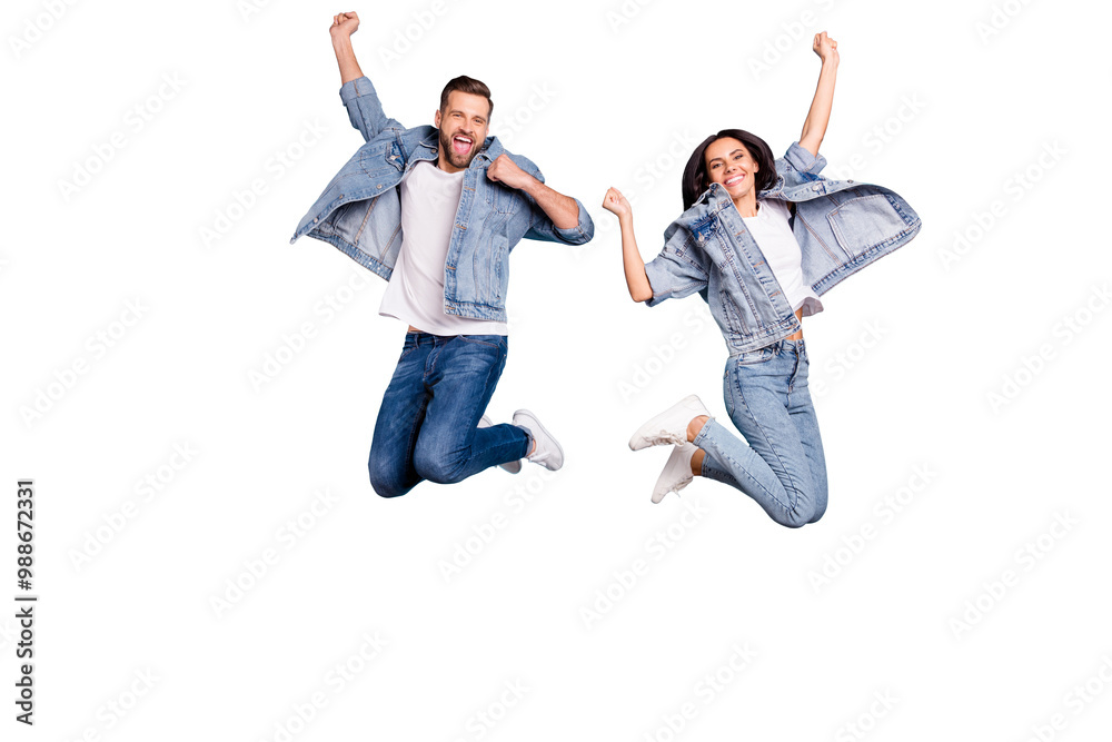 © deagreez - Photo of overjoyed joyful cute nice couple of spouses jumping flying in air happily while isolated with blue background