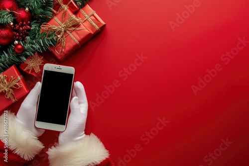 Mobile phone and hand of Santa Claus with Christmas gifts on red background with space for text with generative ai