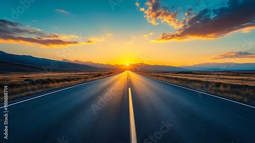 Asphalt Road Leading to Sunset in Mountain Landscape Photo