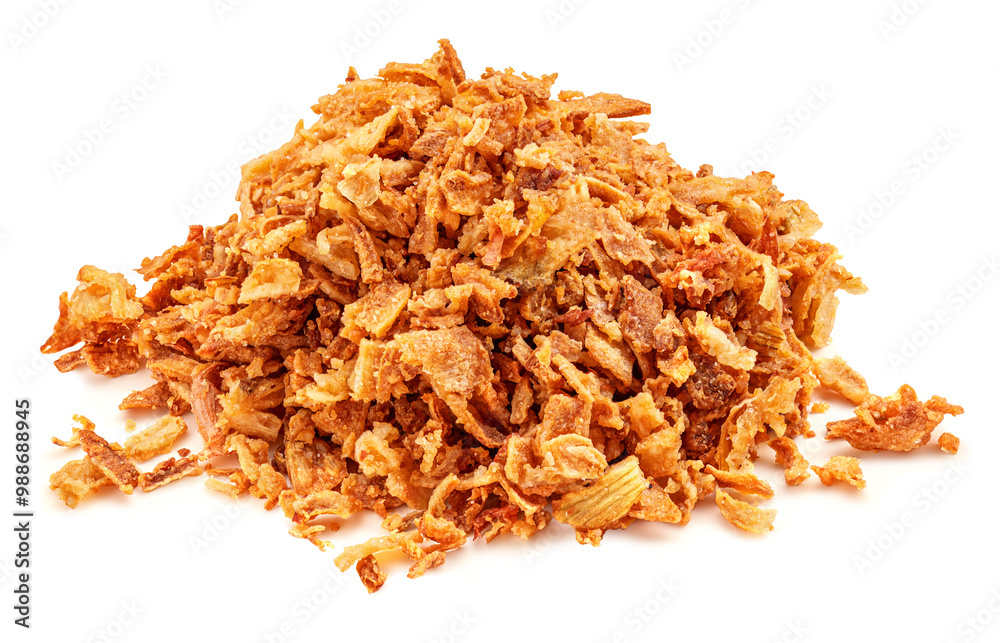 Pile of crispy fried onions isolated on white. Roasted Onions. Scattered Dry Onion Pieces closeup. Pile of crispy fried onions isolated on white. Roasted Onions. Scattered Dry Onion Pieces closeup.