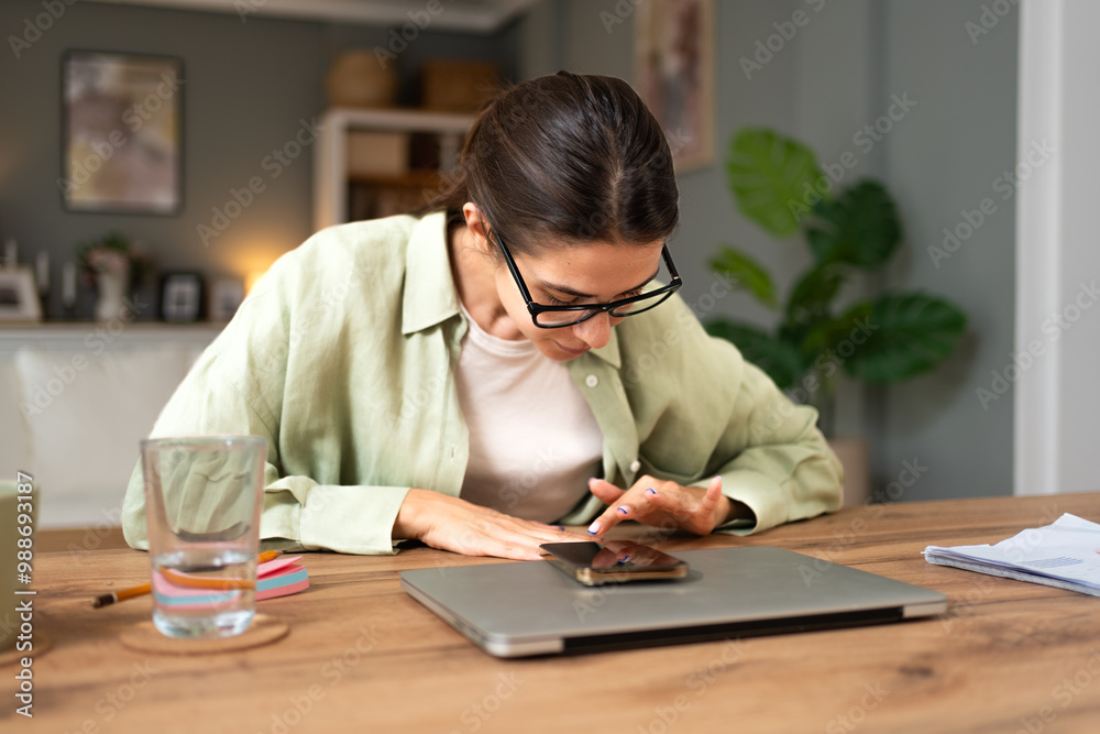 Serious thoughtful employee sitting at table with laptop in home office, thinking over business problems, project, future career vision, feeling doubts, uncertain, dreaming and wondering and waiting Serious thoughtful employee sitting at table with laptop in home office, thinking over business problems, project, future career vision, feeling doubts, uncertain, dreaming and wondering and waiting