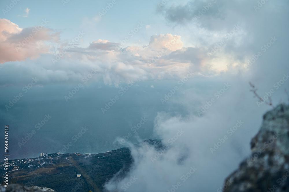 Obraz premium Scenic view of the Aegean Sea and clouds from the summit of a mountain in picturesque Greece