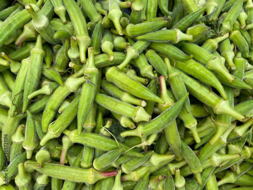 Okra or Okro or, Abelmoschus esculentus, known in many English-speaking countries as ladyfingers or ochre, also called bhindi is grown in the Greek garden. Healthy vegetarian food.