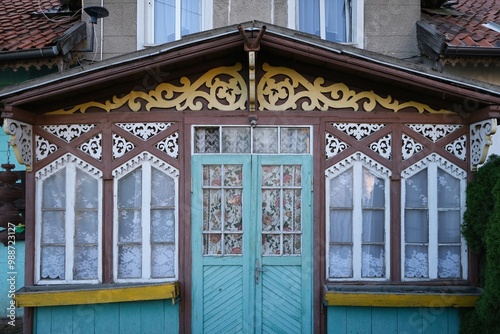 Rychliki, Poland - 22 September 2024: Decorative wooden porch of old building in Rychliki village in Warmia