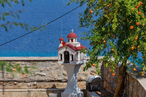 small orthodox chapel  on garden with sea view in Afytos on the Kassandra-Chalkidiki peninsula - Greece photo