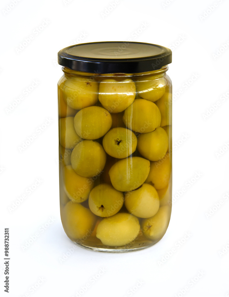Jar of pickled olives in glass jar with black lid isolated on white background. Green pitted olives. Olive jars for design Jar of pickled olives in glass jar with black lid isolated on white background. Green pitted olives. Olive jars for design