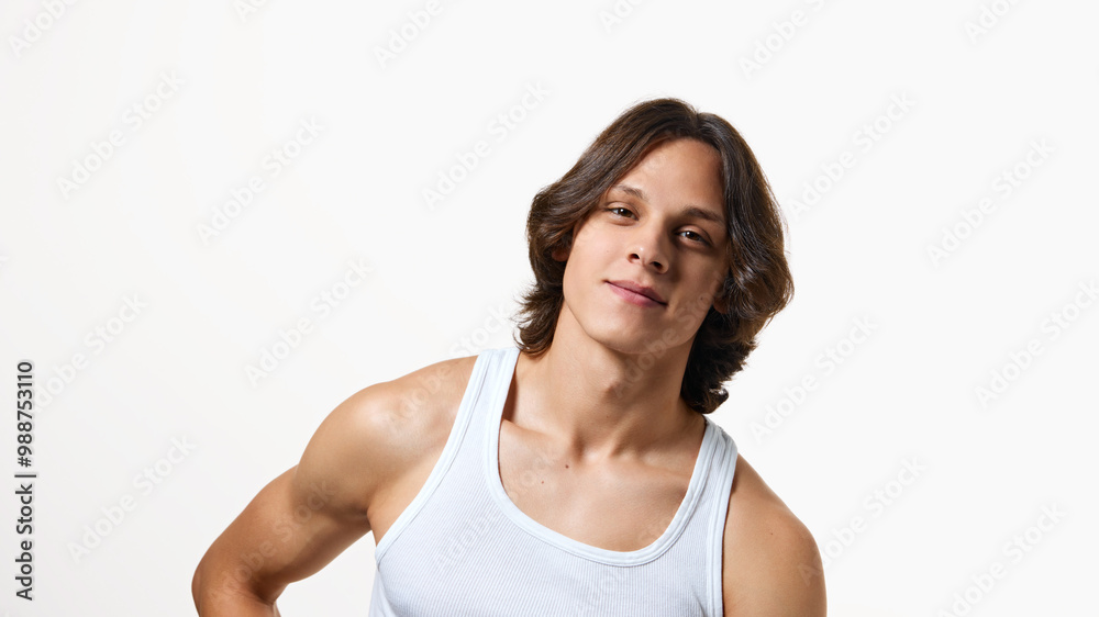 Banner. Portrait of brunette young man looking at camera with light smile against white studio background. Copy space. Concept of natural beauty, fashion, cosmetic product, male health. Ad Banner. Portrait of brunette young man looking at camera with light smile against white studio background. Copy space. Concept of natural beauty, fashion, cosmetic product, male health. Ad