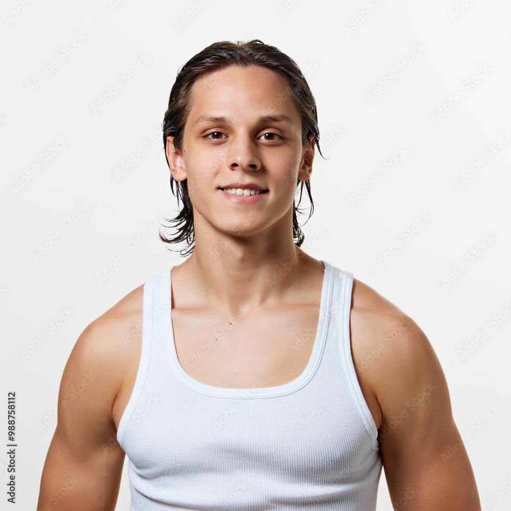 Portrait of young attractive man with we hair after bath treatments looking at camera and smiling against white studio background. Concept of natural beauty, fashion, cosmetic product, male health. Ad Portrait of young attractive man with we hair after bath treatments looking at camera and smiling against white studio background. Concept of natural beauty, fashion, cosmetic product, male health. Ad