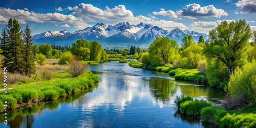 The river flows tranquilly, surrounded by lush greenery and snow-capped mountains in the picturesque town of Rexburg, Idaho. The river flows tranquilly, surrounded by lush greenery and snow-capped mountains in the picturesque town of Rexburg, Idaho.