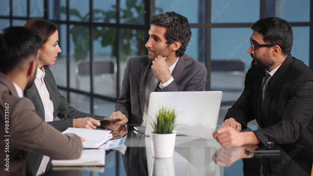 Fototapeta premium Teamwork - discussion in the office. young and successful