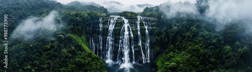 An awe-inspiring and incredibly detailed photo of a vast and misty waterfall, crashing into a crystal-clear pool below surrounded by lush greenery