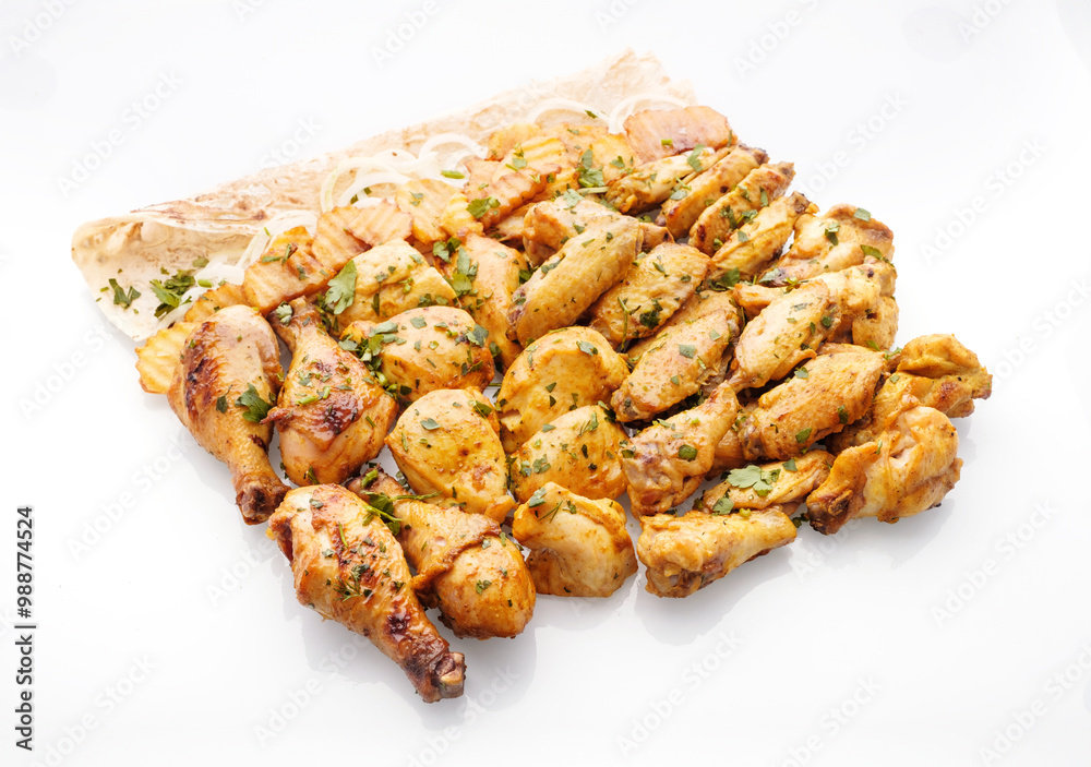 Deliciously grilled chicken pieces served on a platter with fresh herbs and lemon slices, perfect for outdoor gatherings or family feasts Deliciously grilled chicken pieces served on a platter with fresh herbs and lemon slices, perfect for outdoor gatherings or family feasts
