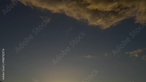 timelapse of floating orange clouds at sunset