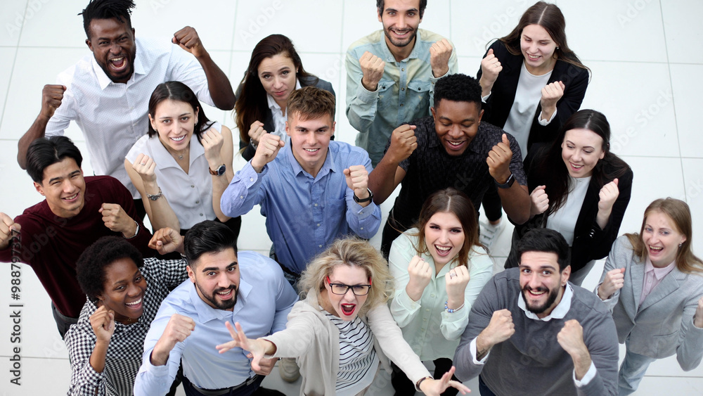 overhead view of businesspeople looking up and waving overhead view of businesspeople looking up and waving