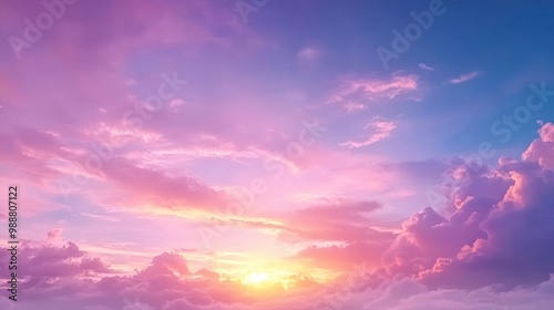 A vibrant sunset over clouds, showcasing a blend of pink and purple hues in the sky.