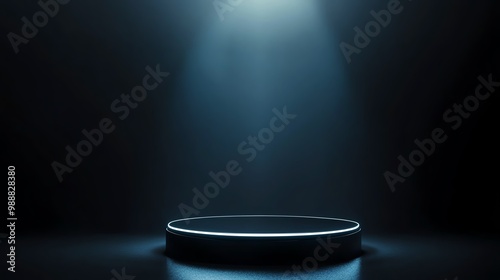 A spotlight illuminates a circular platform in a dark setting, perfect for presentations or showcases.