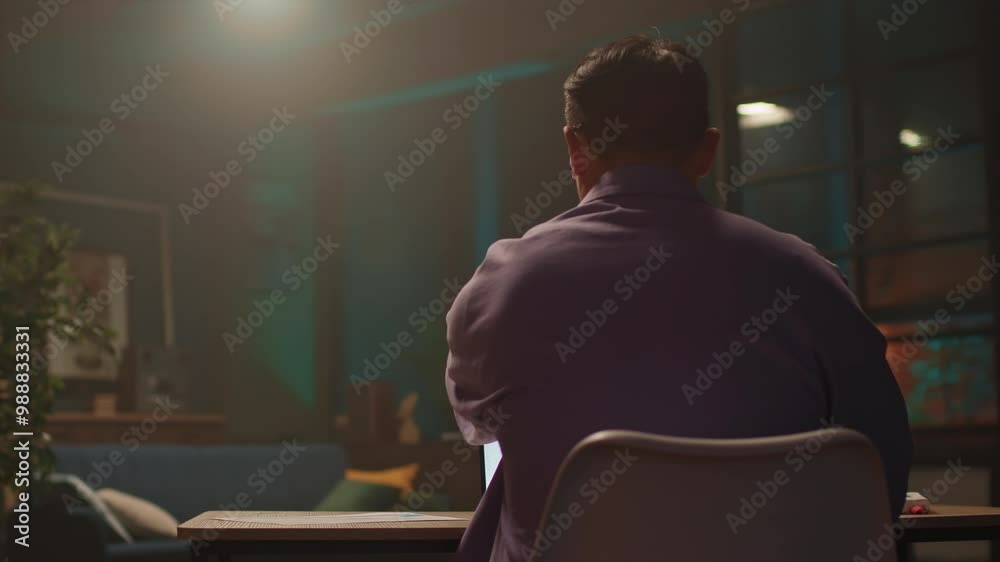 Attractive asian businessman with glasses use laptop and doing notes. Working at night time. Serious look on screen. 360 degree. Moving around Attractive asian businessman with glasses use laptop and doing notes. Working at night time. Serious look on screen. 360 degree. Moving around